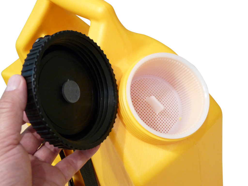 Black Thermoplastic Rubber Breather Valve installed in Lid on Backpack Sprayer